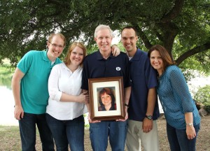 Melissa McKneely (far right) with siblings and father (holding photograph of her mother.)