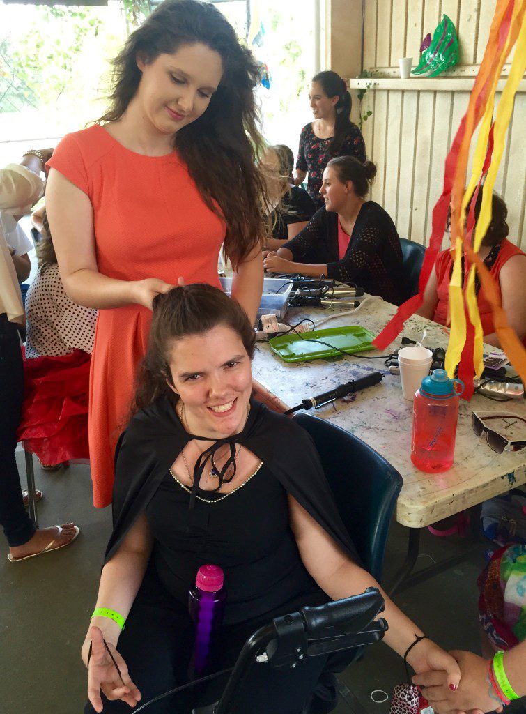 Volunteer Katie Freeman with camper Rania, whose hair she styled