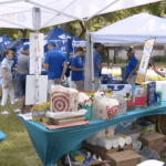 JustServe booth at BYU Tailgate on FOX 4 DFW