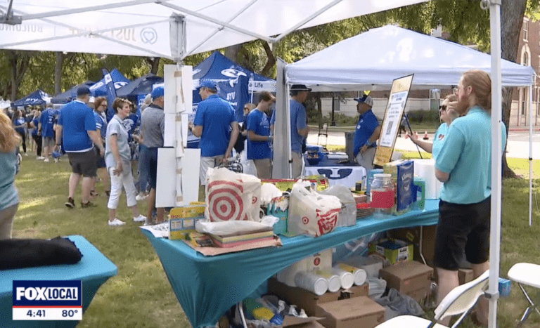 JustServe booth at BYU Tailgate on FOX 4 DFW